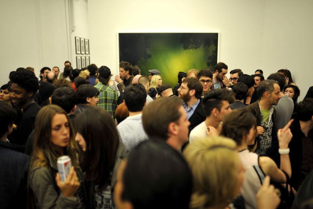 The opening for Ryan McGinley, "Everybody Knows This Is Nowhere," at Team Gallery in 2010. Photo by RYAN MCCUNE/Patrick McMullan via Getty Images.