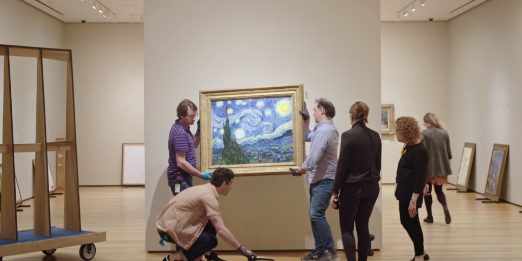 Art handlers with Vincent van Gogh's Starry Night at the Museum of Modern Art, New York. Photo courtesy of the Museum of Modern Art, New York.