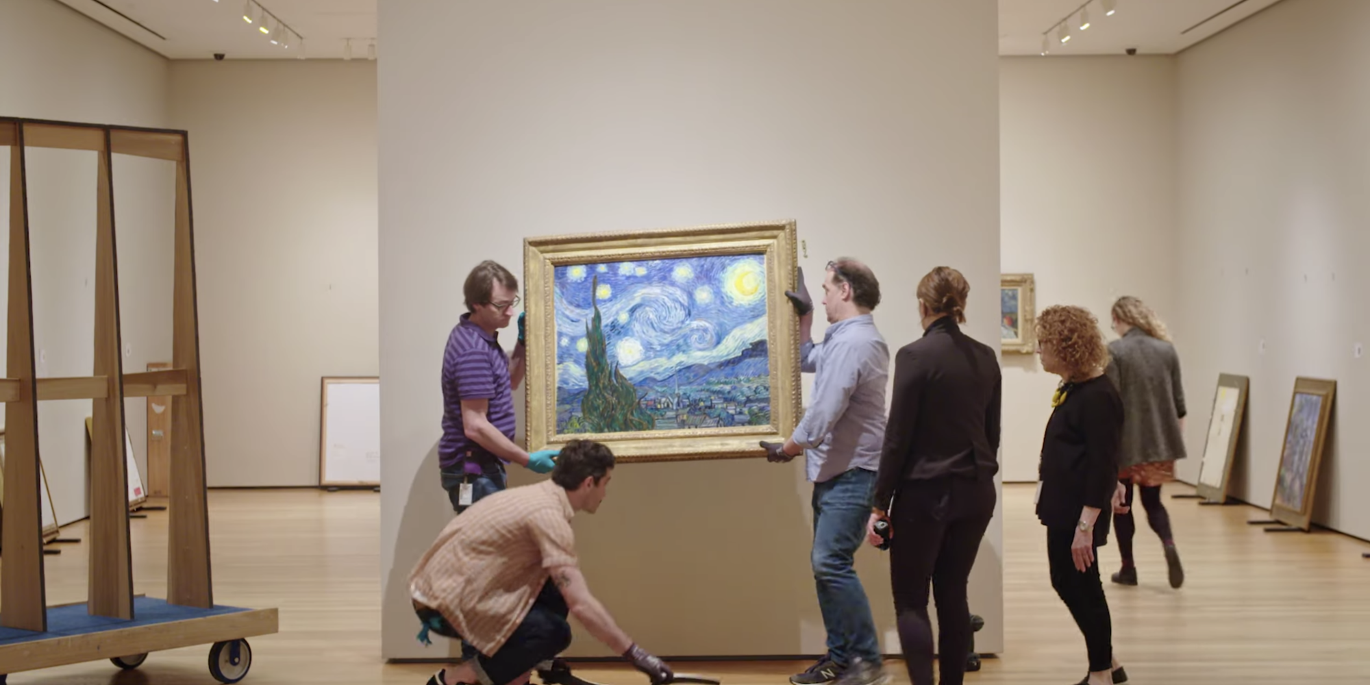 Art handlers with Vincent van Gogh's Starry Night at the Museum of Modern Art, New York. Photo courtesy of the Museum of Modern Art, New York.