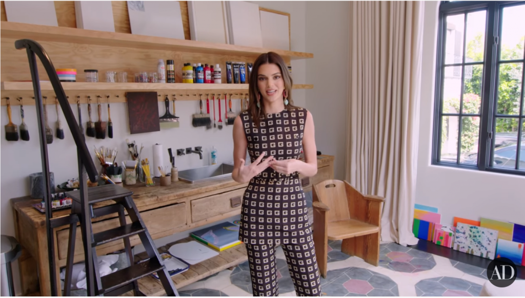 Kendall Jenner in her arts-and-crafts room. Screen shot via <em>Architectural Digest</eM>.