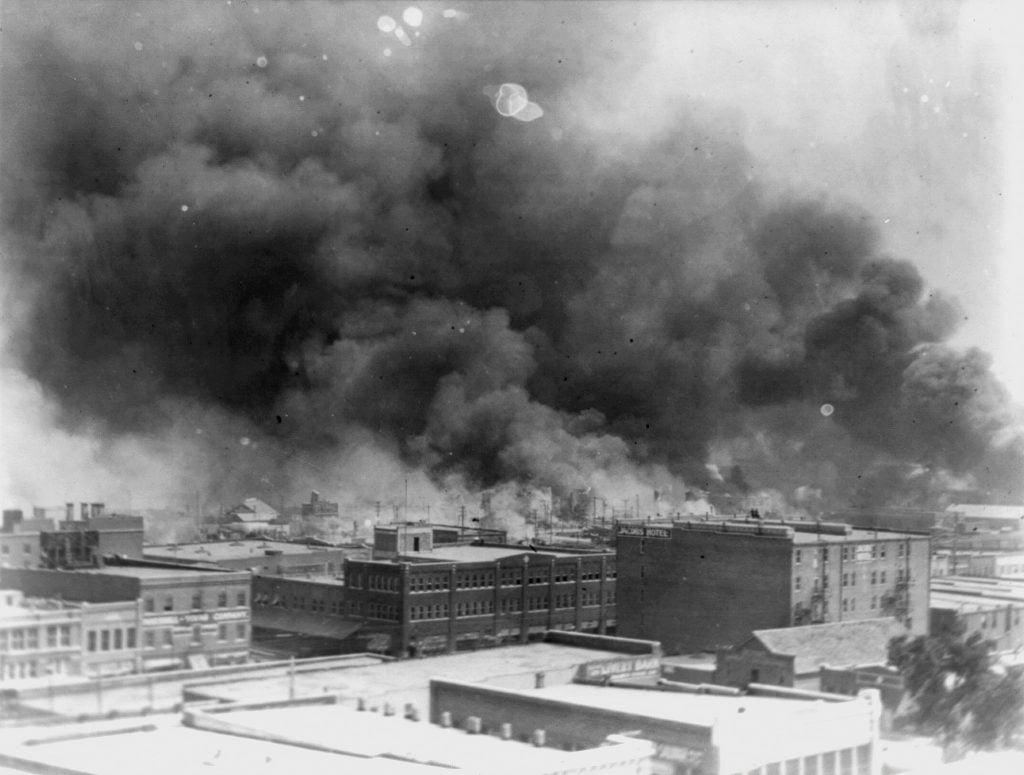 The Greenwood neighborhood on the north side of Tulsa, known as Black Wall Street, set on fire by a white mob in 1921, killing over 300 people. Photo by Alvin C. Krupnick Co. for the Associated Press, courtesy of the Library of Congress.