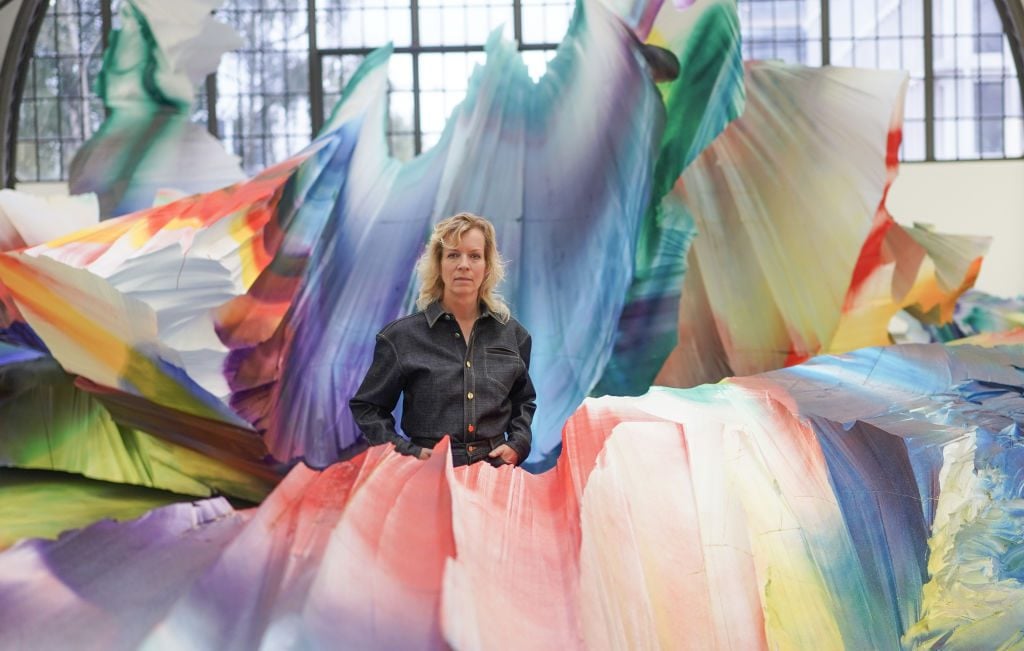 Katharina Grosse stands in her artwork 