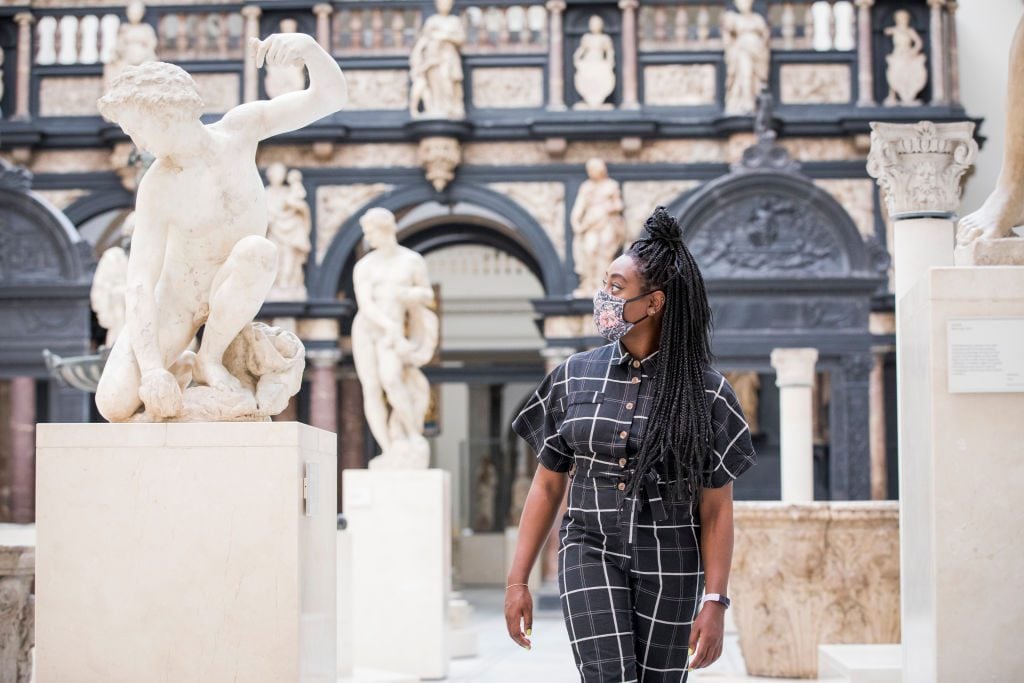 A staff member at the V&A before it temporarily reopened after 140 days of lockdown, the longest period of closure in the museum's history. Photo by Tristan Fewings/Tristan Fewings/Getty Images for The V&amp;A.