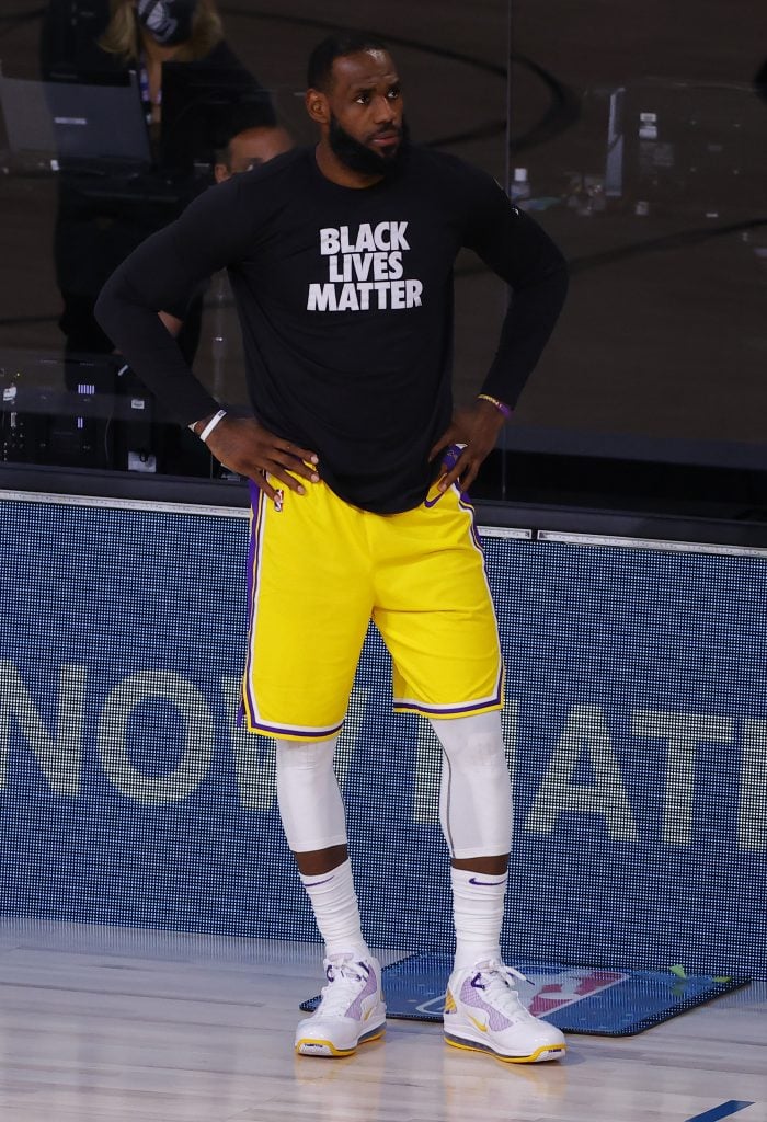 LeBron James waiting to check into a playoff game against the Portland Trail Blazers after NBA players voted to resume the season in the wake of their wildcat strike earlier the same week. (Photo by Kevin C. Cox/Getty Images)