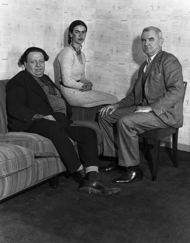 Diego Rivera and Frida Kahlo with Anson Conger Goodyear, then president of the Museum of Modern Art, upon the artists' arrival in New York in 1931. Courtesy of Getty Images.
