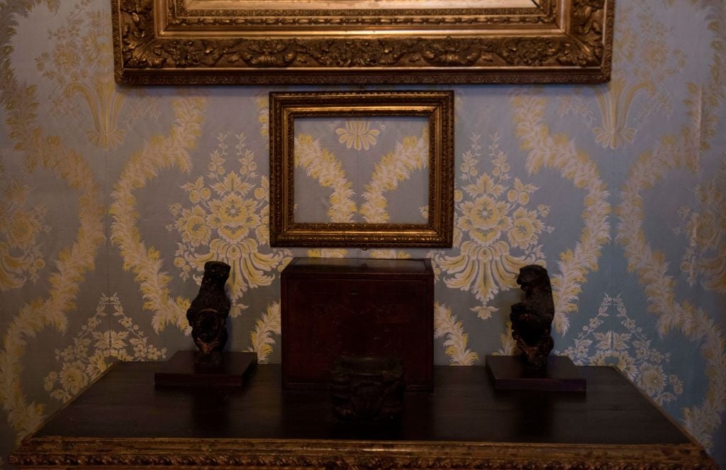 An empty frame at the Isabella Stewart Gardner Museum. Photo by Ryan McBride/AFP via Getty Images.