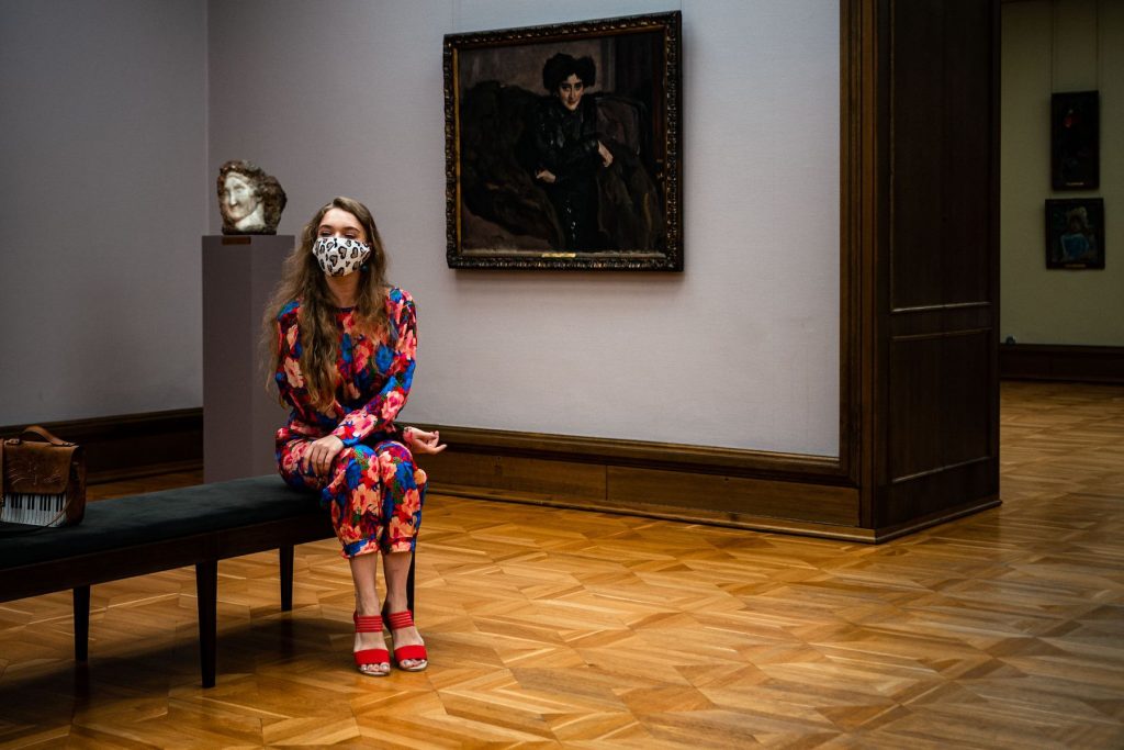 A visitor wearing a protective face mask looks at paintings at the State Tretyakov Gallery as the gallery opened following the easing of measures against the spread of coronavirus disease (COVID-19), in Moscow on July 3, 2020. (Photo by Dimitar Silkoff / AFP via Getty Images)