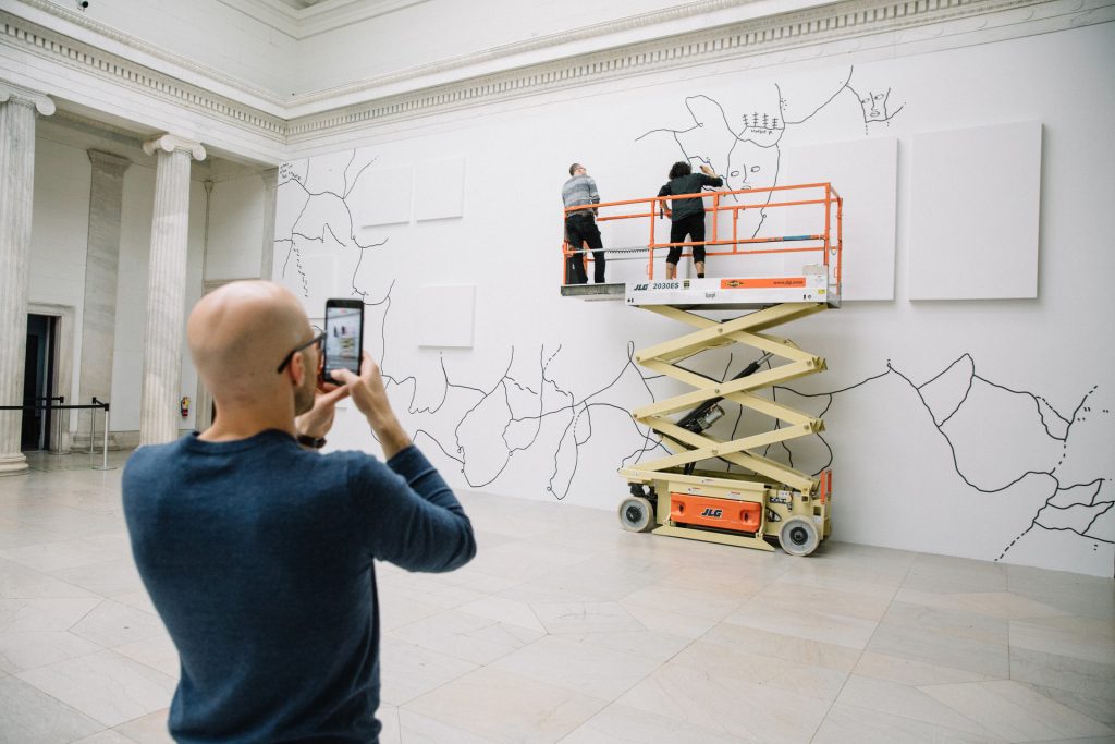 Shantell Martin creating a site-specific mural for the 2017 exhibition "Shantell Martin: Someday We Can." Photo courtesy of the Albright-Knox Art Gallery, Buffalo.