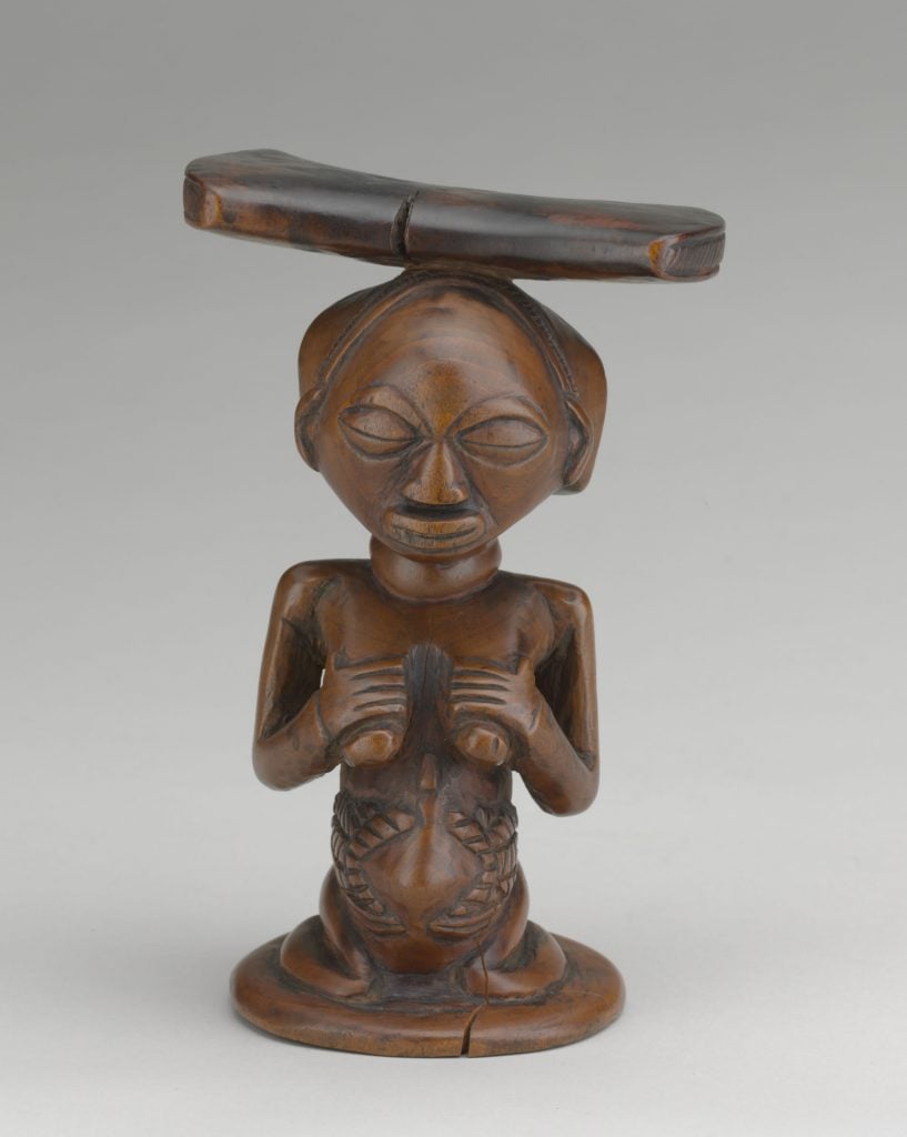 Artist unidentified, Caryatid Headrest (early 20th century). Luba region, Democratic Republic of the Congo. Photo courtesy of the Baltimore Museum of Art.