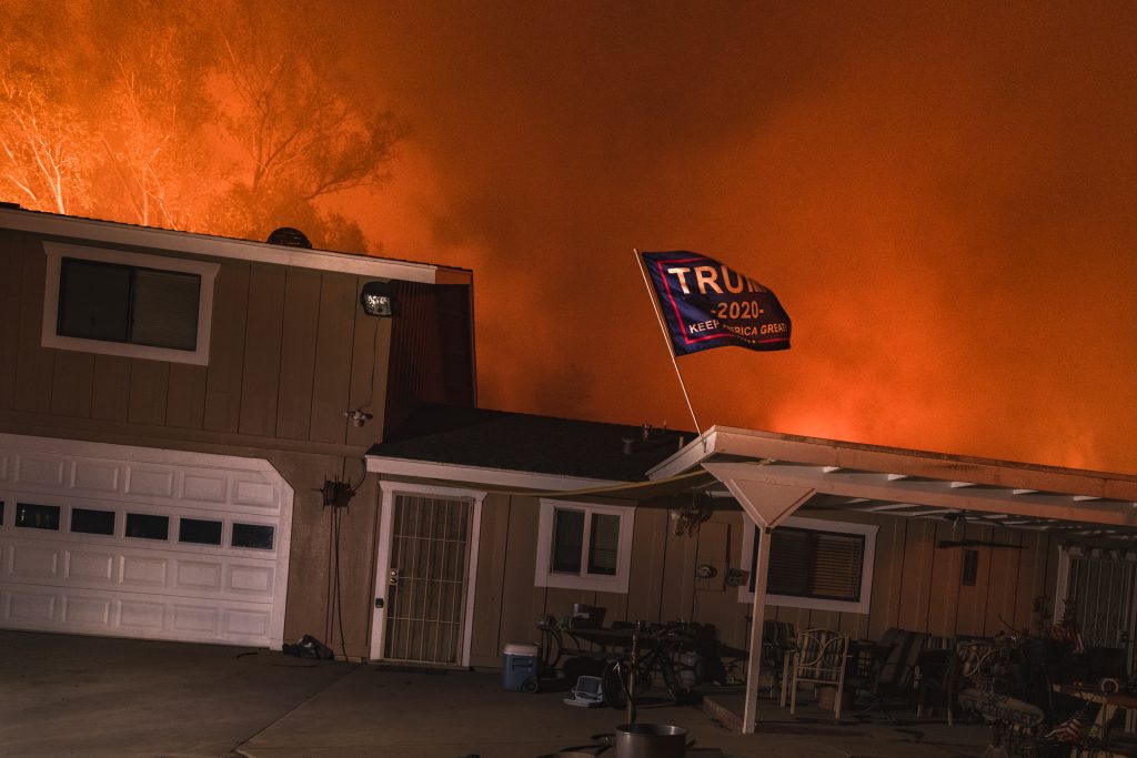 Jeff Frost captured this shot of a Trump flag illuminated by the light of the Lake Fire in San Diego County. Photo courtesy of the artist.