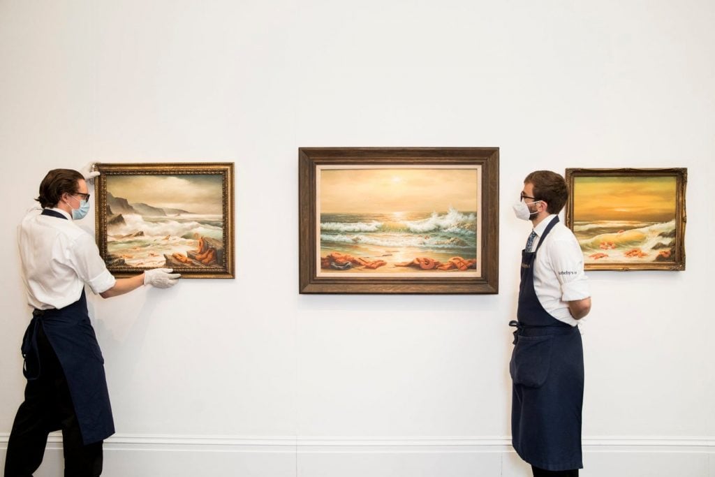 Banksy's <i>Mediterranean Sea View</i> (2017) at Sotheby's. (Photo by Tristan Fewings/Getty Images for Sotheby's)