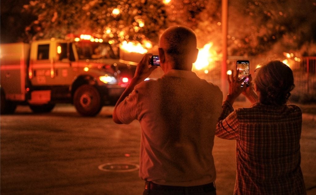 Jeff Frost captured this shot of a couple photographing a California wildfire. Photo courtesy of the artist.