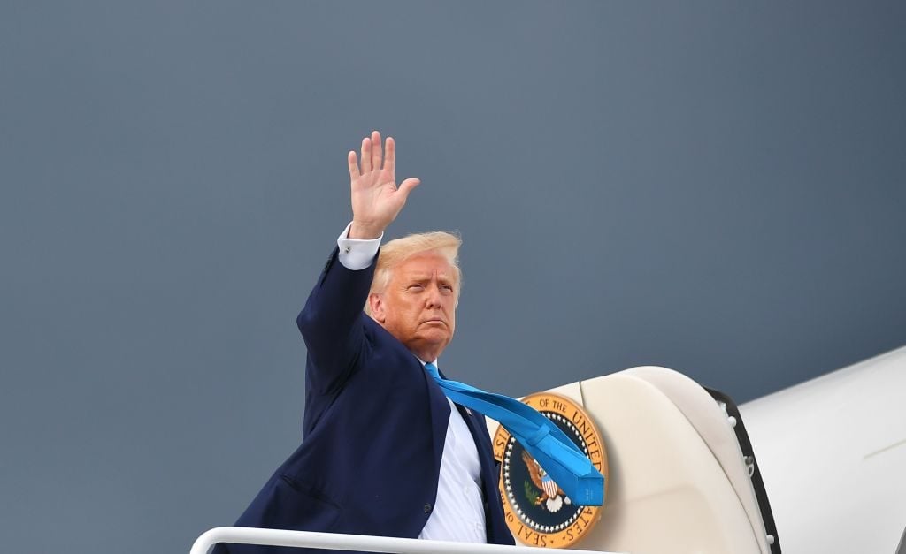 US President Donald Trump makes his way to board Air Force One. (Photo by MANDEL NGAN / AFP) (Photo by MANDEL NGAN/AFP via Getty Images)