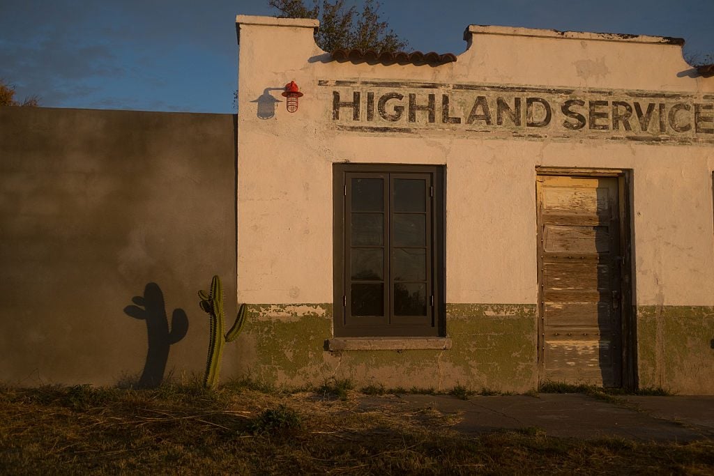 A cactus casts a shadow in the early morning sun against the wall of a building in Marfa. Photo by Epics/Getty Images.