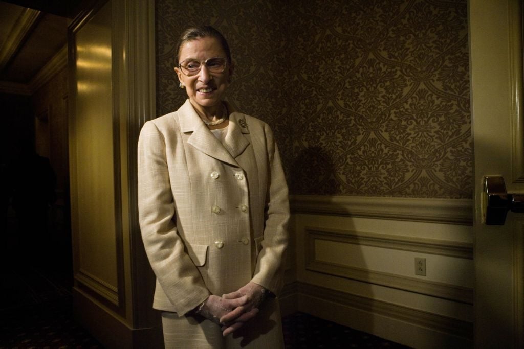 U.S. Supreme Court Justice Ruth Bader Ginsburg waits to enter a dinner to honor Michelle Bachelet, Chile's first female president, May 8, 2006 in Washington, DC. Photo: Brendan Smialowski/Getty Images.