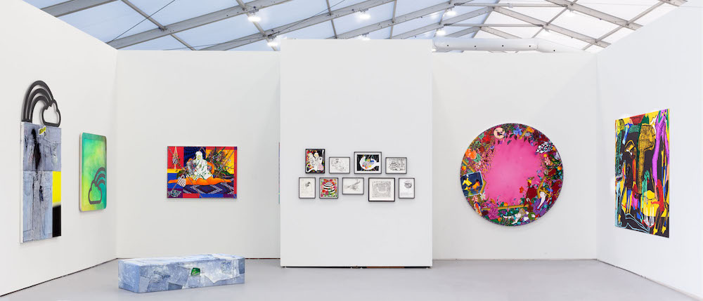 Installation view of Shulamit Nazarian's 2019 booth presentation at UNTITLED, Miami Featuring artists: Amir H. Fallah, Trenton Doyle Hancock, Summer Wheat, and Wendy White. Image courtesy of Shulamit Nazarian, Los Angeles