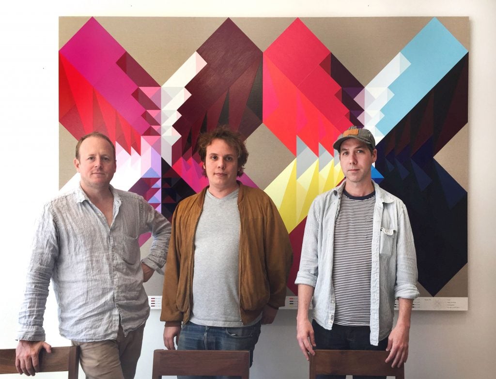 Pascal Spengemann, Max Levai, and Leo Fitzpatrick in front of a work by Andrew Kuo. Photo courtesy Marlborough.