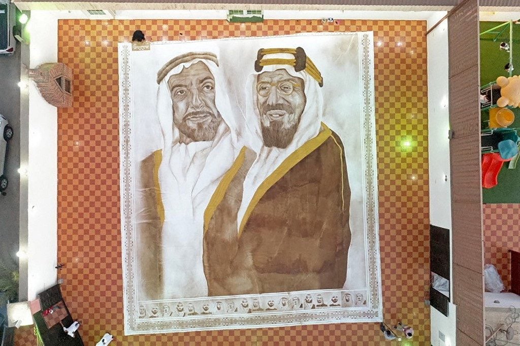 The world's largest coffee painting, <em>Naseej 1</em> by Saudi artist Ohud Abdullah Almalki, depicts founding fathers of Saudi Arabia and the UAE, the late King Abdulaziz bin Abdul Rahman (right) and the late Sheikh Zayed bin Sultan Al Nahyan, in Jeddah. Photo courtesy of Guinness World Records.