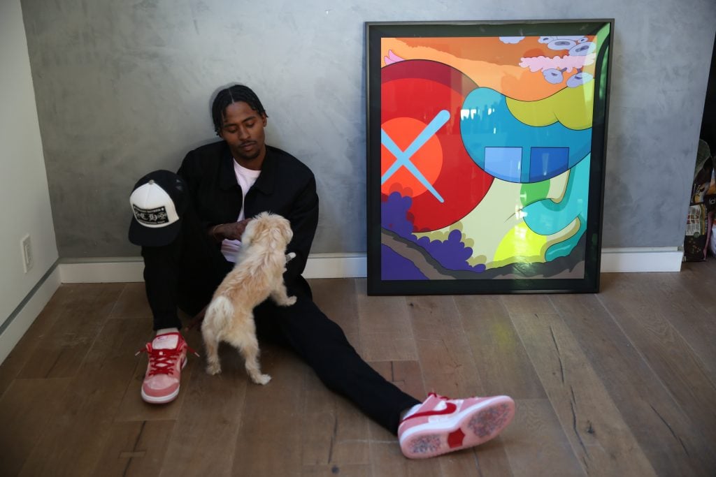 Moe Harkless at home with his collection. Photography by Cecile Boko. Courtesy of Moe Harkless.