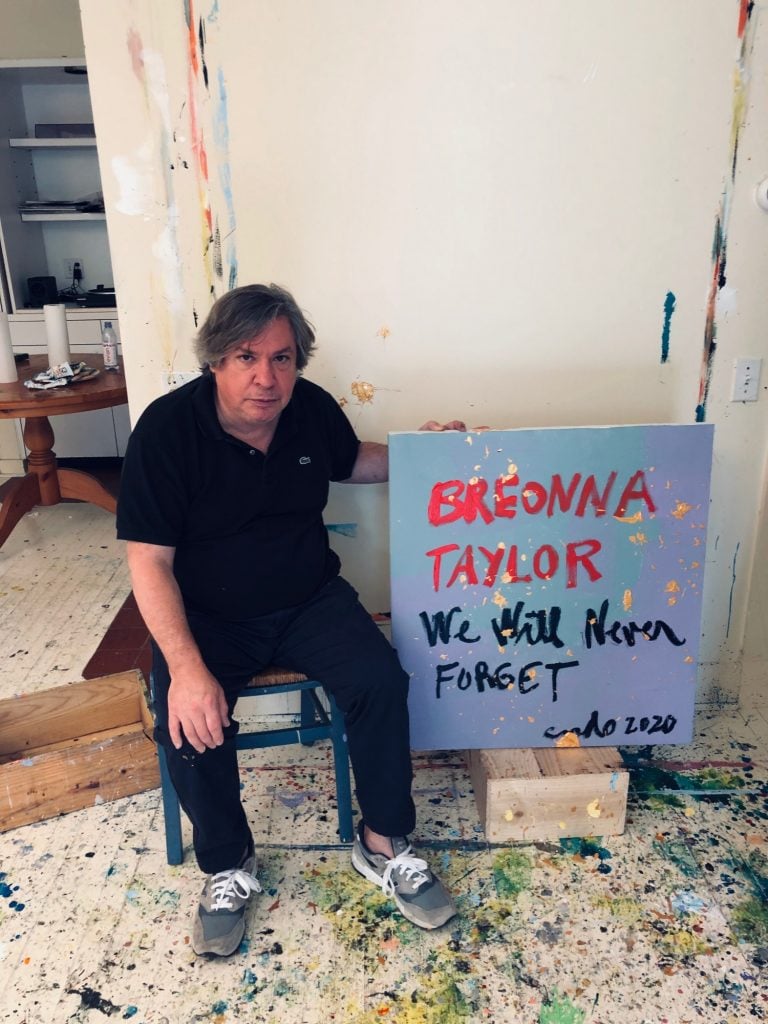 George Condo with his painting <em>Painting for Breonna Taylor</em> for the “Show Me the Signs” auction. Photo courtesy of the African American Policy Forum.