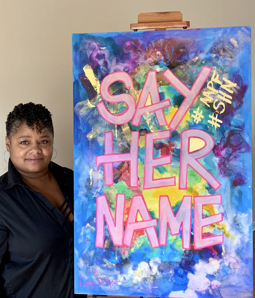 Glenyse Thompson with her sign <em>The Night Has A Thousand Eyes</em> for the “Show Me the Signs” auction. Photo courtesy of the African American Policy Forum.