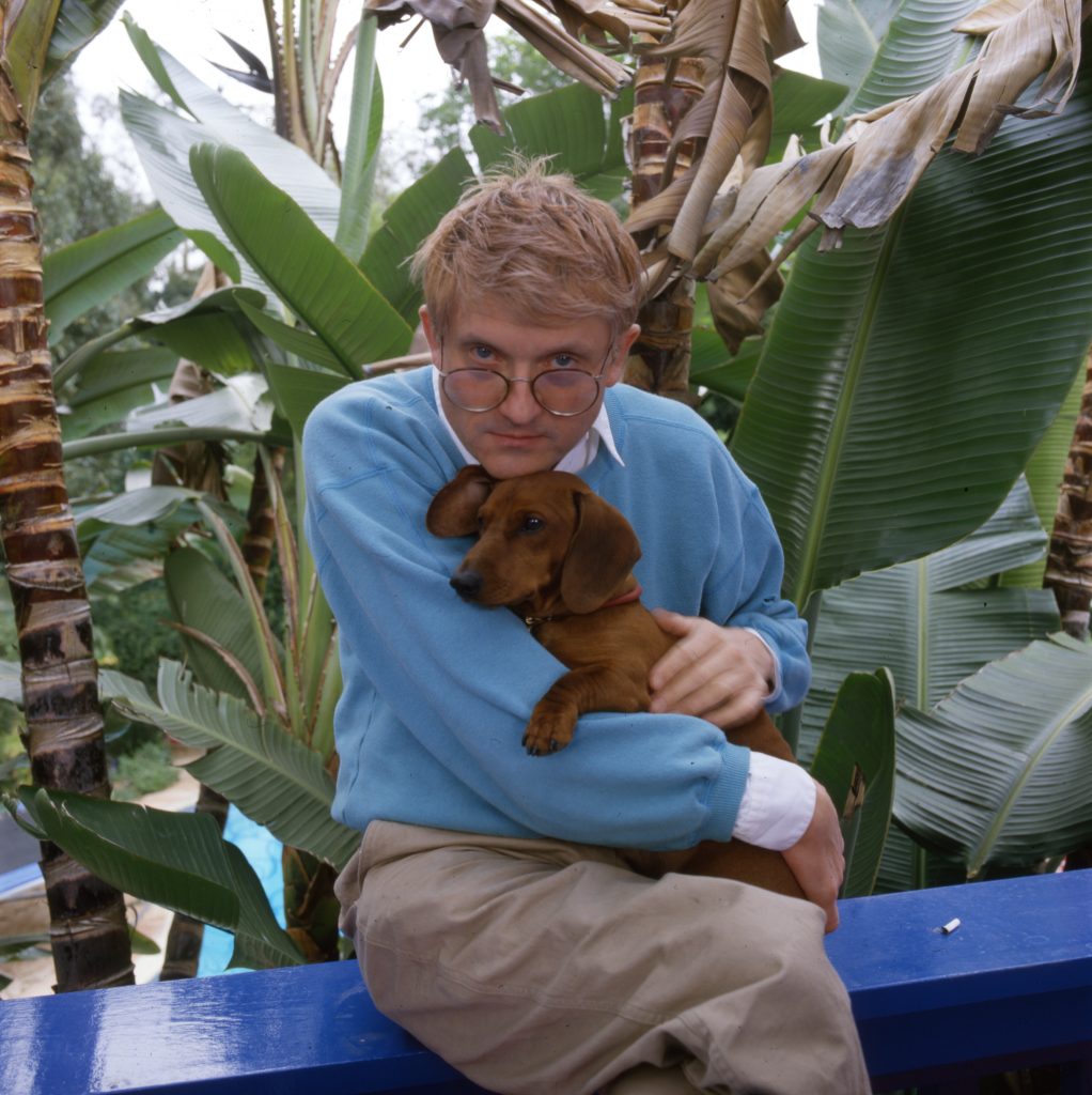David Hockney with one of his beloved dachschunds. (Photo by Anthony Barboza/Getty Images)