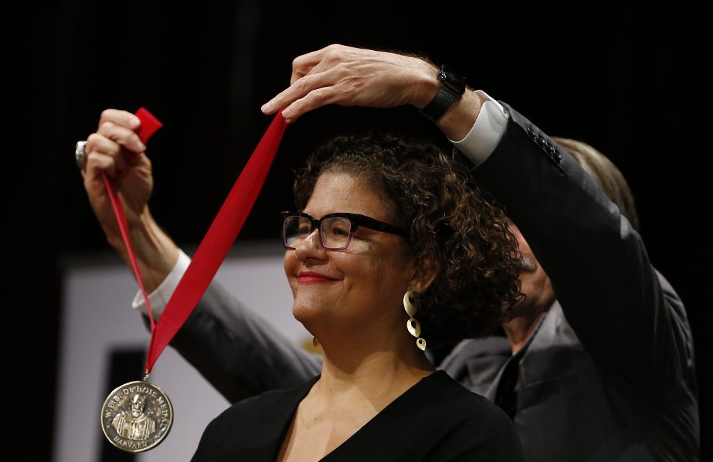 Elizabeth Alexander, president of the Andrew W. Mellon Foundation, is awarded the W.E.B Du Bois Medal during a Ceremony at Harvard's Sanders Theater. Photo by Jessica Rinaldi/The Boston Globe via Getty Images.