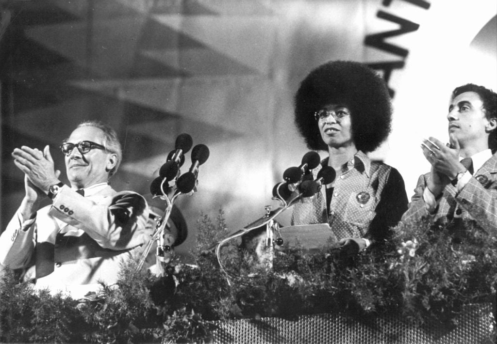 General Secretary of the Socialist Unity Party of Germany, Erich Honecker, with civil rights activist Angela Davis in East Berlin in 1973. The Albertinum will open a show focused on the legacy of Angela Davis in East Germany on October 10 called "1 Million Roses for Angela Davis." Photo by Giehr/picture alliance via Getty Images.