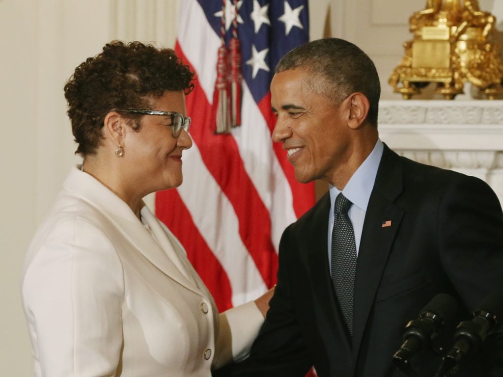 President Barack Obama greets American poet Elizabeth Alexander at the White House. Photo by Mark Wilson/Getty Images.