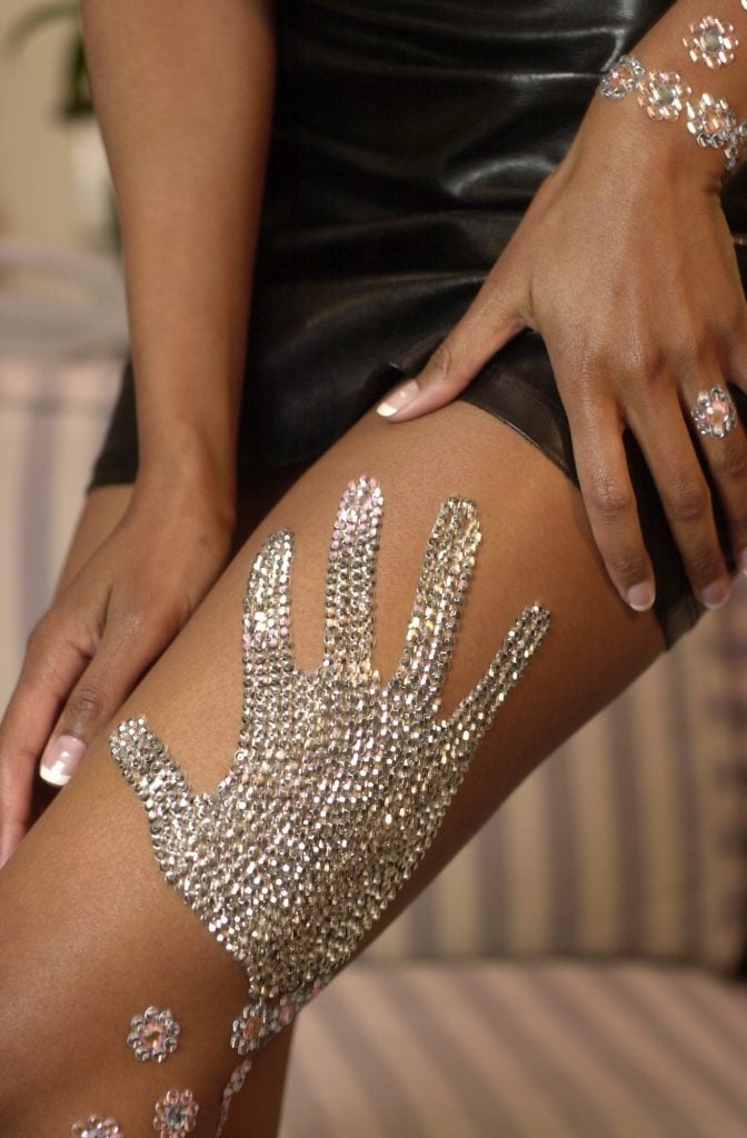 Actress Traci Bingham wearing rhinestones by body decor artist Tina-Marie Stoker. Photo by David McNew/Newsmakers/Getty Images. 