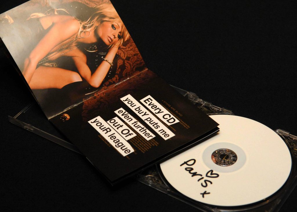 A Paris Hilton limited edition CD, sleeve and case,(2006), customized by graffiti artist Banksy at The Hard Rock Cafe in London. (Photo by Clive Gee - PA Images/PA Images via Getty Images)