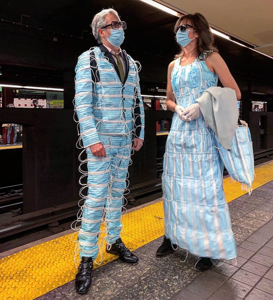 Adrian Wilson and Heidi Hankaniemi, <em>Wear a Mask</em> on the subway. Photo by Tudor Vasilescu.