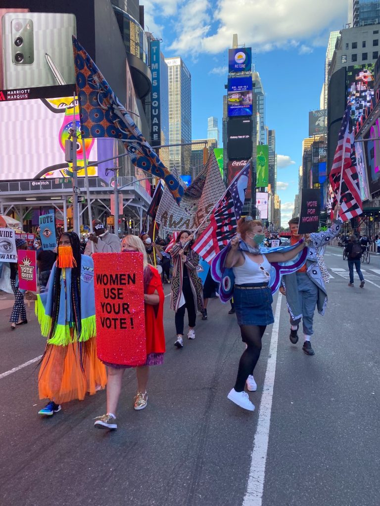 Ebony Brown and Michele Pred leading the Vote Feminist March in Times Square for the Wide Awakes. Photo by Sarah Cascone. 