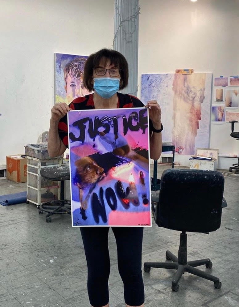 Marilyn Minter with her painting <em>Justice Now</em> for the “Show Me the Signs” auction. Photo courtesy of the African American Policy Forum.
