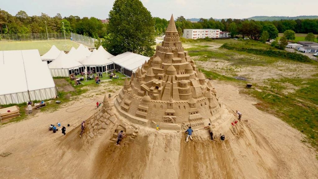 The Skulptura Projects GmbH built the world's tallest sand castle at Sandskulpturen Festival in 2019. Photo courtesy of Guinness World Records. 