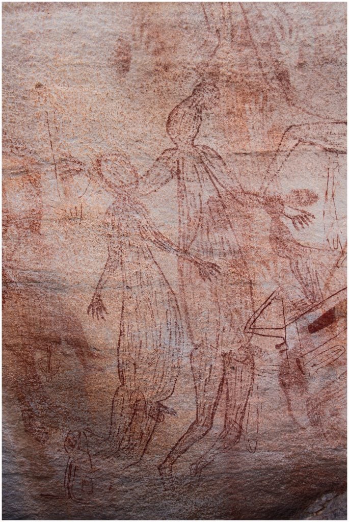 Large male Maliwawa human figures from an Awunbarna site. Photo by Paul Taçon.