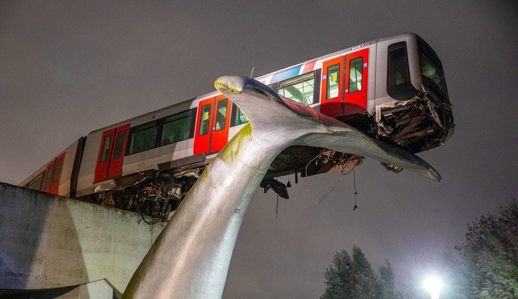The perilously perched metro car in Spijkneisse, saved by the Whale Tail. Photo Courtesy Twitter.