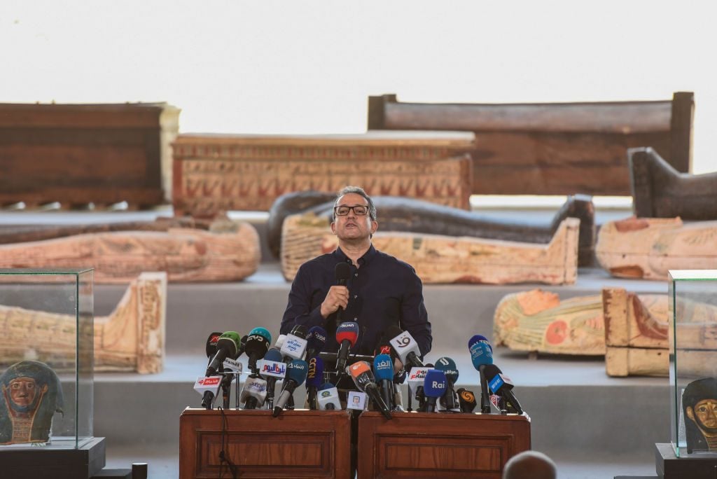 Egyptian Minister of Antiquities and Tourism Khaled El Anany speaks during a press conference at Saqqara to announce the discovery of at least 100 ancient coffins, some with mummies inside. Photo: Mohammed Fouad/dpa via Getty Images.
