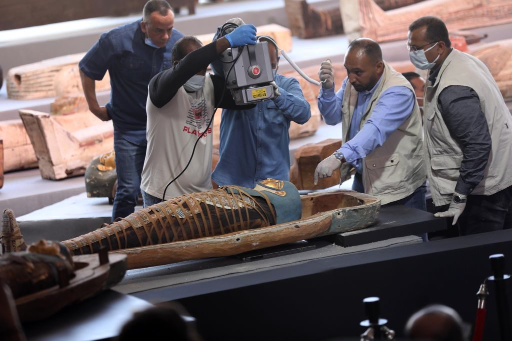Experts conduct an X-Ray examination for a mummy inside a coffin on the site of the wooden coffin discovery in Giza province, Egypt, on Nov. 14, 2020. Photo: Xinhua/Ahmed Gomaa via Getty Images.