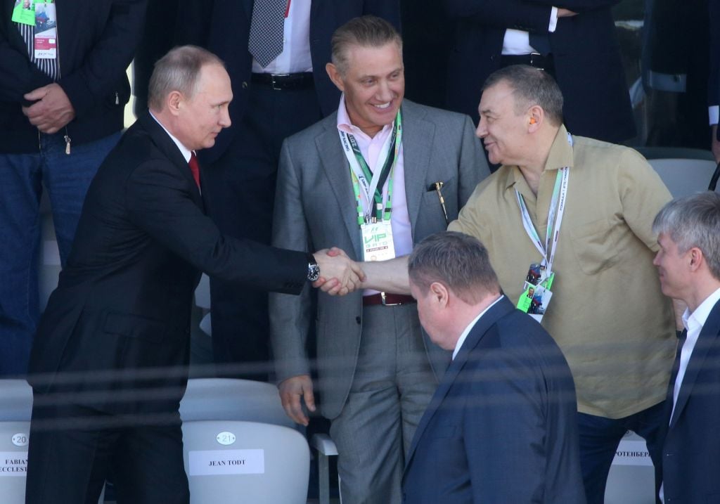 Russian President Vladimir Putin with billionaire businessman Arkady Rotenberg as his brother, Boris Rotenberg, at the 2017 Formuila 1 Russian Grand Prix in Sochi , Russia, April, 30, 2017. Photo: Mikhail Svetlov/Getty Images.