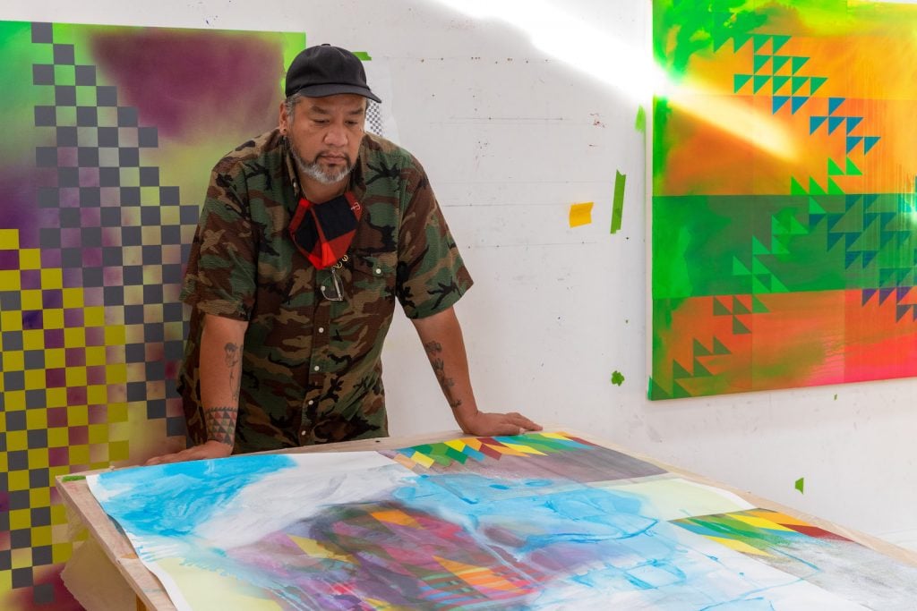 Jeffrey Gibson working in the studio. Photo courtesy of the artist.