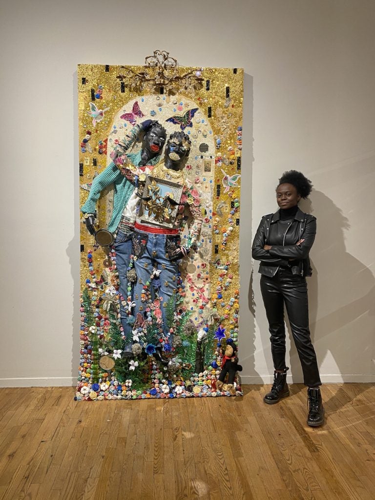 Destinee Ross-Sutton with <i>The Embrace</i> by Vanessa German.