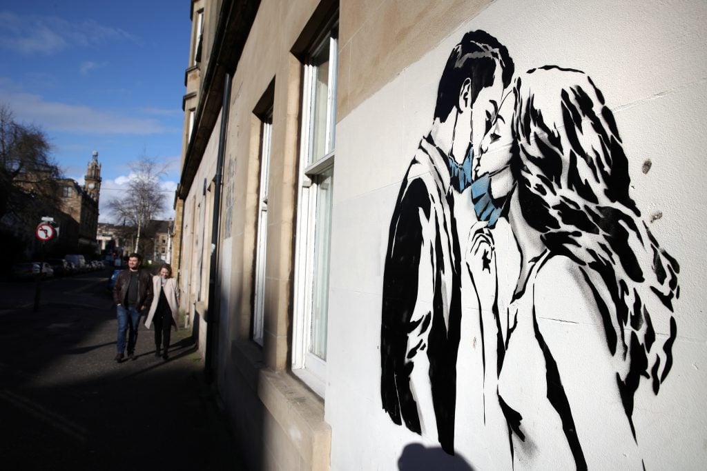 Street art by Rebel Bear on a wall on Bank Street in Glasgow. Photo by Andrew Milligan/PA Images via Getty Images.