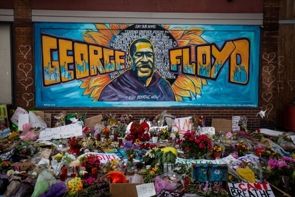 The makeshift memorial and mural by Xena Goldman, Cadex Herrera, and Greta McClain outside Cup Foods where George Floyd was murdered by a Minneapolis police officer on Sunday, May 31, 2020 in Minneapolis, Minnesota. Photo by Jason Armond/Los Angeles Times via Getty Images.