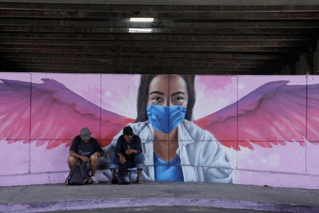 Street art of a medical worker with wings wearing protective mask to illustrate the Coronavirus (COVID-19 ) pandemic in Mexico City. Photo by Ricardo Castelan Cruz/Eyepix Group/Barcroft Studios/Future Publishing via Getty Images.