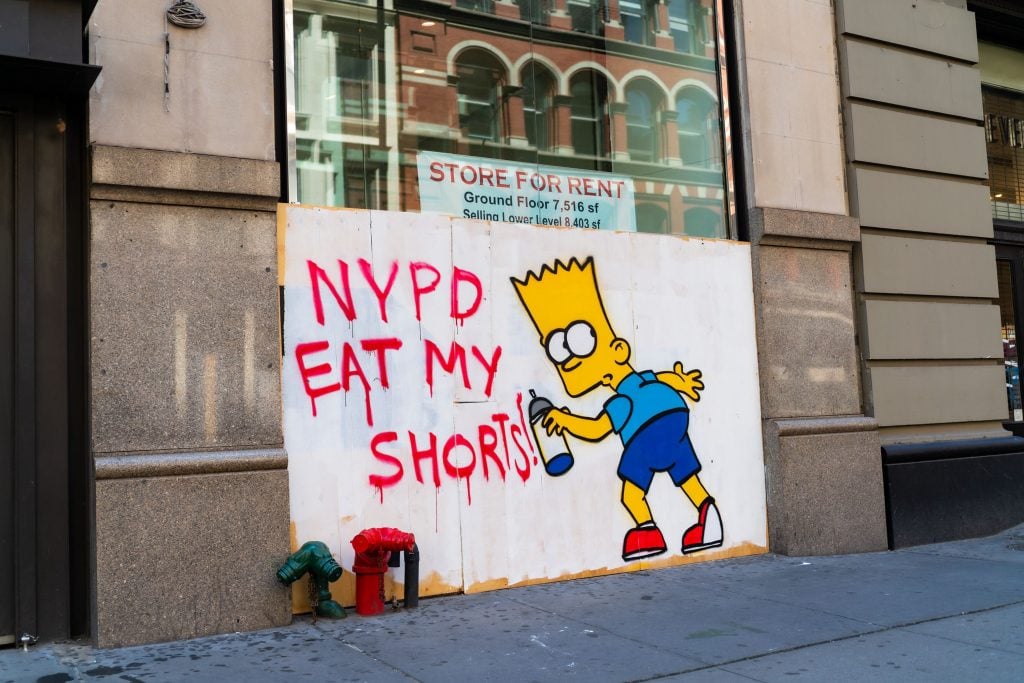 Street art featuring the character Bart Simpson is on display on a boarded-up building in SoHo on June 21, 2020 in New York City. Photo by Gotham/Getty Images.