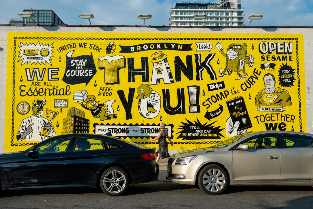 A person walks past a large "Thank you" mural in Williamsburg, Brooklyn, on August 17, 2020. Photo by Alexi Rosenfeld/Getty Images.