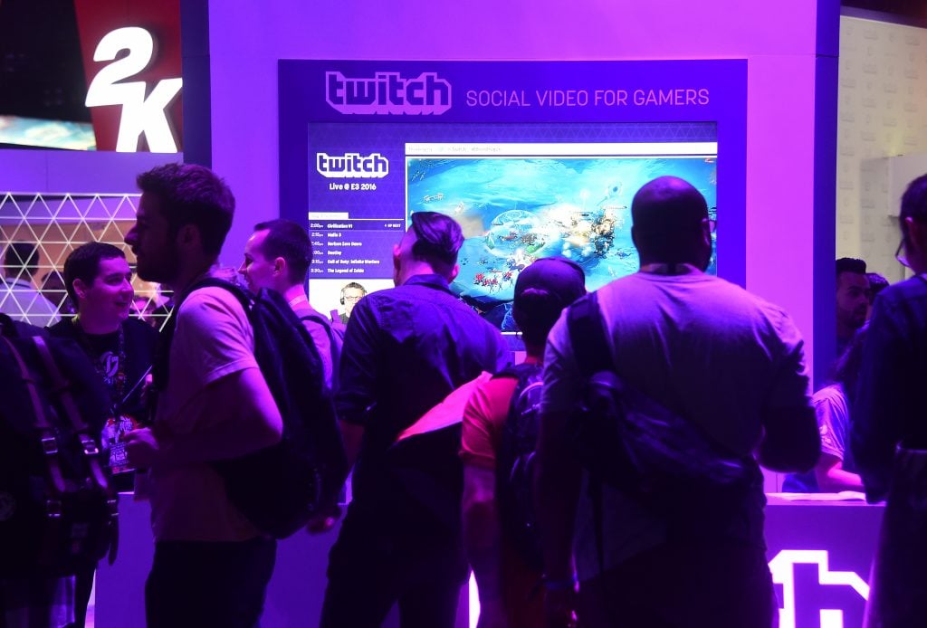 People wait in line at booth for Twitch, the official Livestream Partner of E3 during the 2016 Electronic Entertainment Expo annual video game conference and show on June 14, 2016 in Los Angeles, California. (FREDERIC J. BROWN/AFP via Getty Images)