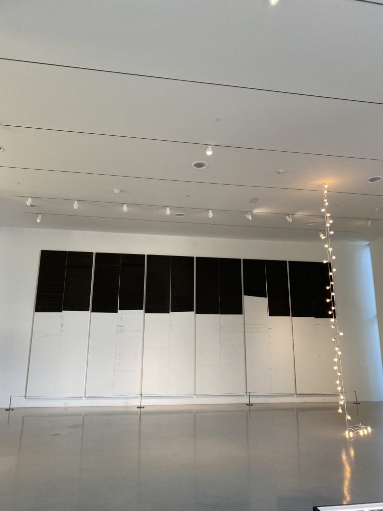 What a sight: Wade Guyton and Felix Gonzalez-Torres at the de la Cruz collection. Photo by Nate Freeman.