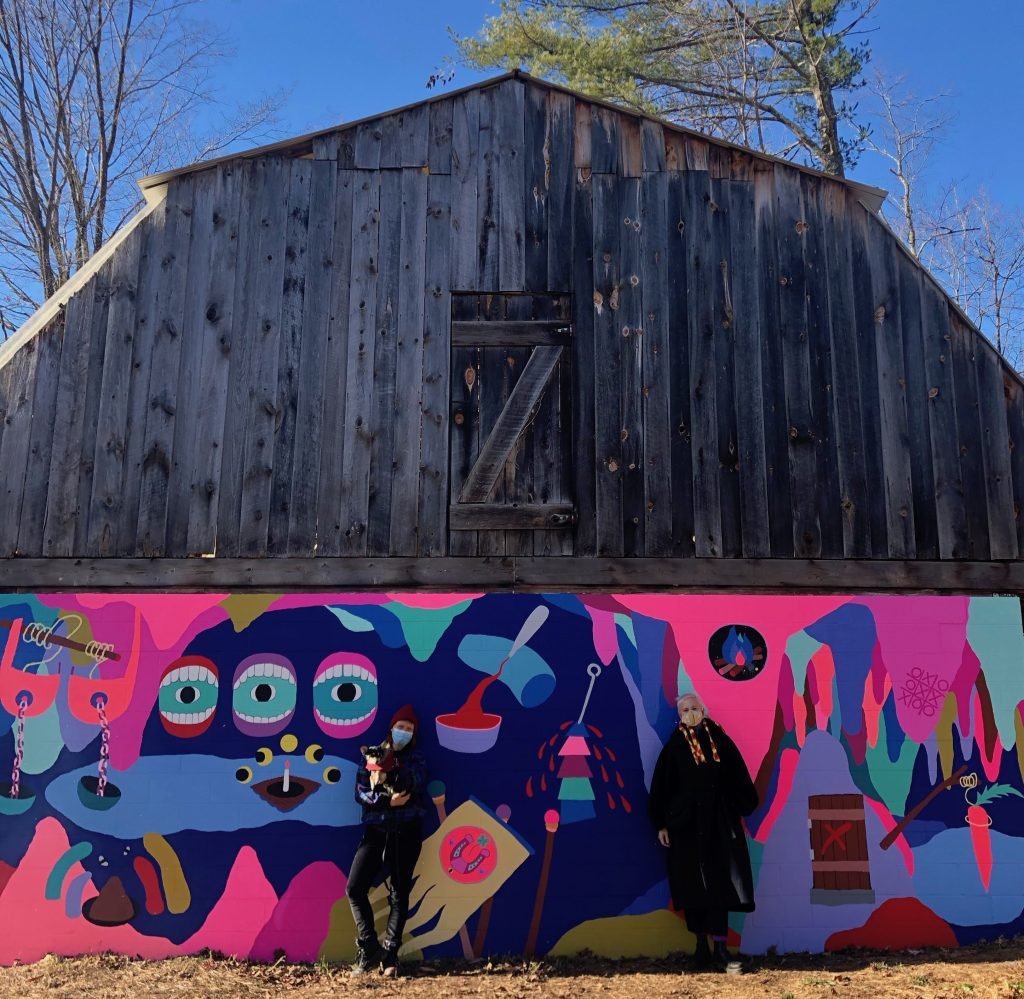 Macon Reed and Helen Toomer in front of the new mural on the STONELEAF RETREAT barn. Photo courtesy of STONELEAF RETREAT.